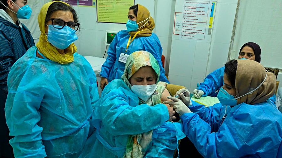 One of the highlights of the vaccination process is a link for downloading the certificate which is also a part of the confirmatory SMS sent to the beneficiary post-vaccination. Credit: PTI Photo