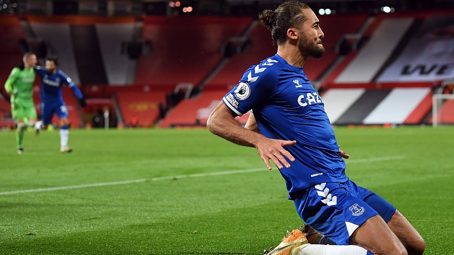 Everton's English striker Dominic Calvert-Lewin celebrates scoring his team's third goal during the English Premier League football match between Manchester United and Everton at Old Trafford in Manchester, north west England, on February 6, 2021. Credit: AFP Photo