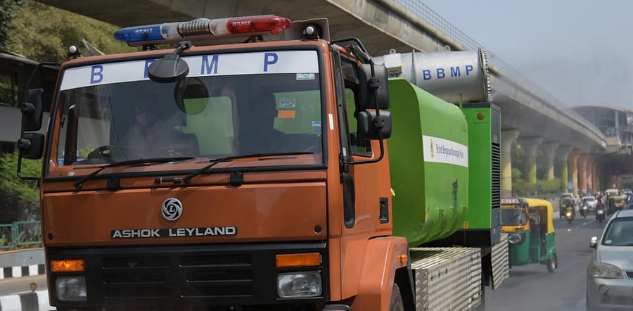 BBMP use mist cannon spraying machines and clean the area near MG Road in Bengaluru. Credit: DH Photo/Pushkar V