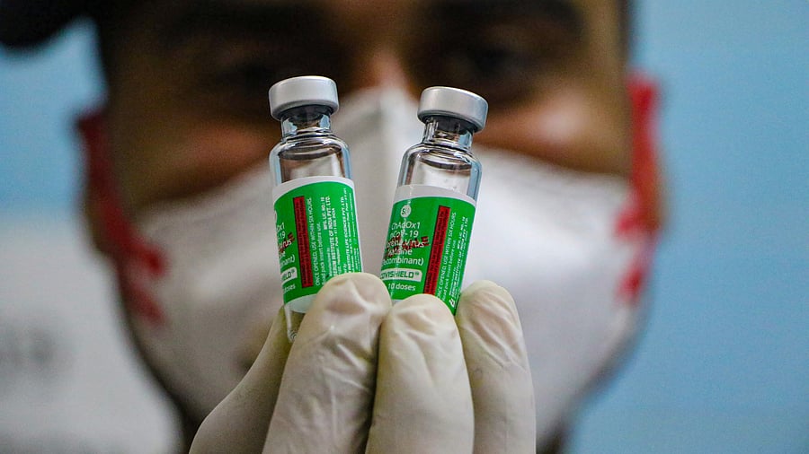 A medic show a vial containing doses of Covishield vaccine during a countrywide inoculation drive. Credit: PTI Photo