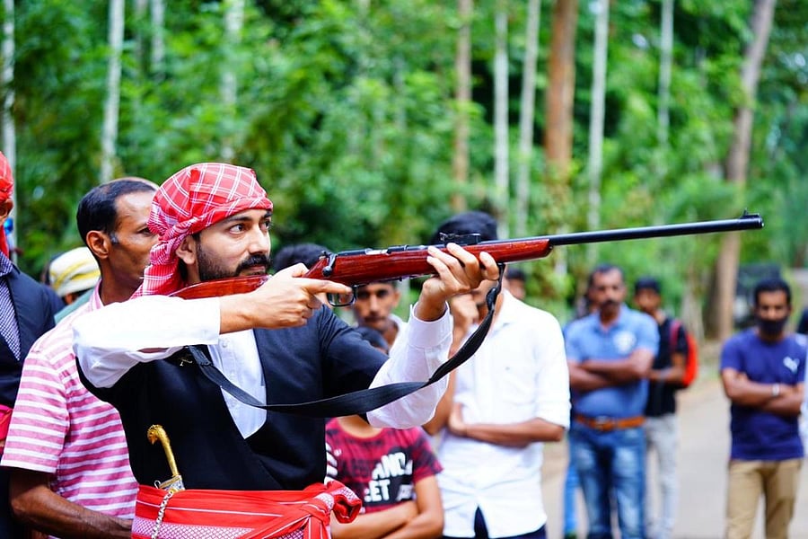 On the day of Kailpodh, people bring their farmhouse guns and odikattis (broad swords) to the village mand in the afternoon. They aim at coconut shells and shoot them.  Photo by Zubair/ Lensmen Photography