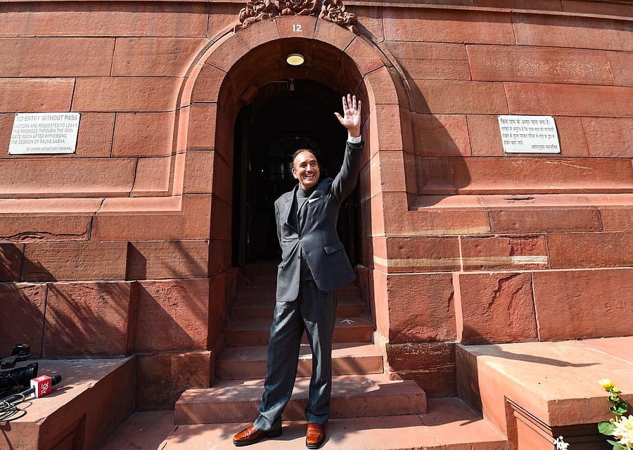 Senior Congress leader Ghulam Nabi Azad, who is retiring from the Rajya Sabha next week, waves at media during the ongoing Budget Session of Parliament, in New Delhi, Tuesday, Feb. 9, 2021. Credit: PTI Photo