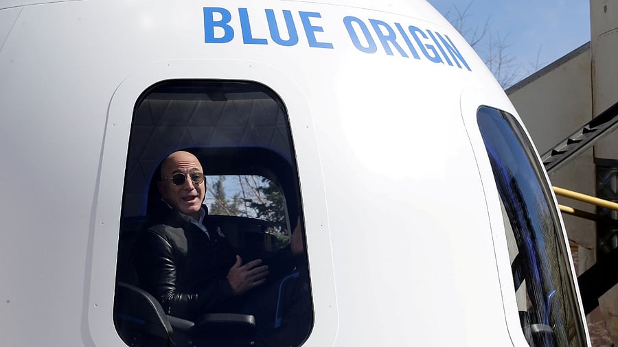 Amazon and Blue Origin founder Jeff Bezos addresses the media about the New Shepard rocket booster and Crew Capsule mockup at the 33rd Space Symposium in Colorado Springs, Colorado, United States April 5, 2017. Credit: Reuters Photo
