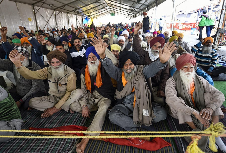 Farmers raise slogans during their ongoing agitation against Centre's farm reform laws, at Singhu border in New Delhi, Thursday, Feb. 4, 2021. Representative image/Credit: PTI Photo