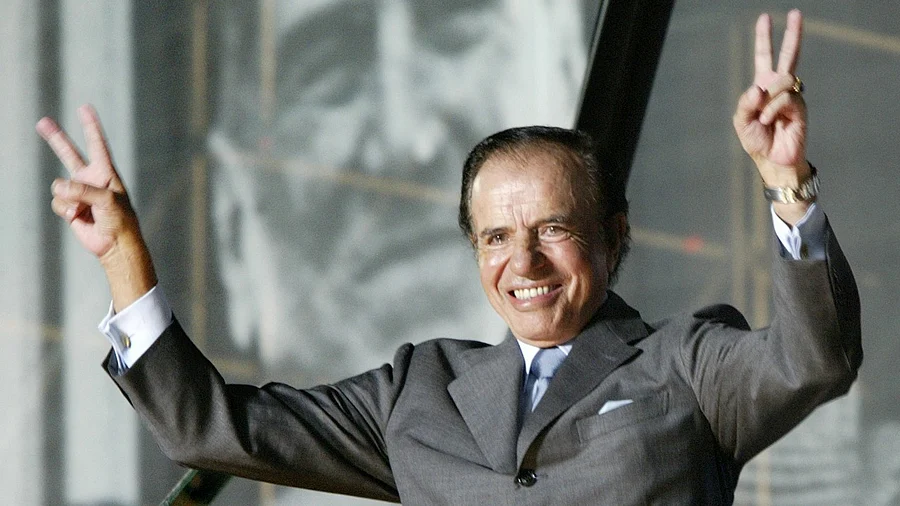 Argentine presidential candidate Carlos Menem waves to thousands of followers in River Plate Stadium in Buenos Aires. Credit: Reuters File Photo