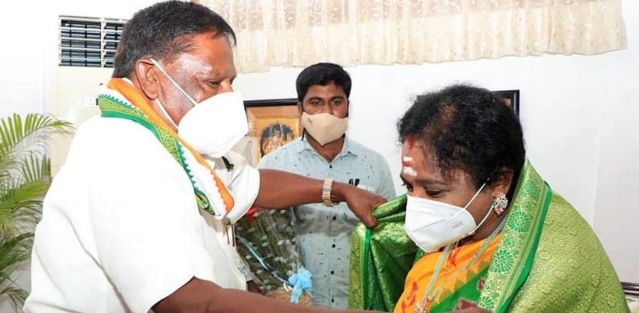 Puducherry CM V Narayanasamy felicitates Telangana Governor Tamilisai Soundararajan after been given additional charge as the Lieutenant Governor of Puducherry at Raj Nivas, in Puducherry, Wednesday. Credit: PTI Photo