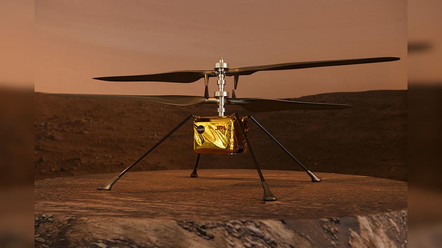 A full scale model of the experimental Ingenuity Mars Helicopter, which will be carried under the Mars 2020 Perseverance rover, is displayed at NASA's Jet Propulsion Laboratory (JPL) on February 16, 2021 in Pasadena, California. Credit: AFP Photo