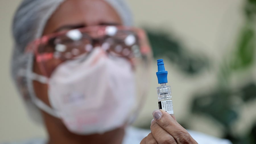 A nurse shows a vial of the Pfizer-BioNTech Covid-19 vaccine. Credit: Reuters Photo