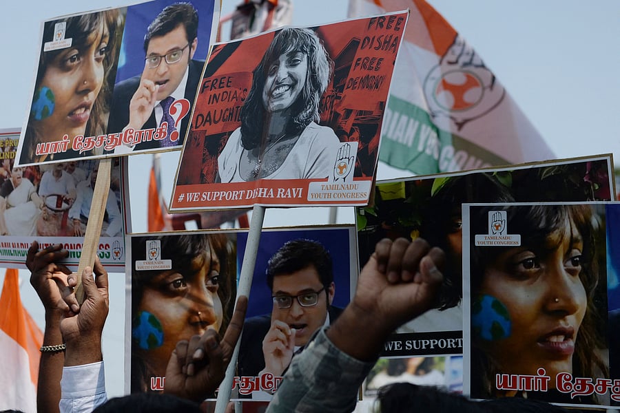 Members of the Indian Youth Congress hold pictures of activist Disha Ravi after her arrest by Delhi police for her alleged involvement in the instigation of violence during the farmers protest on India's Republic Day. Credit: AFP Photo