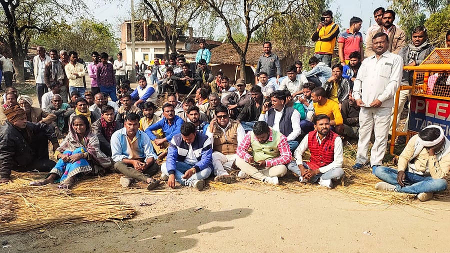 Locals stage a protest after bodies of two minor Dalit girls were found in a field and another in critical condition on Wednesday evening, near Baburaha village in Unnao district. Credit: PTI Photo
