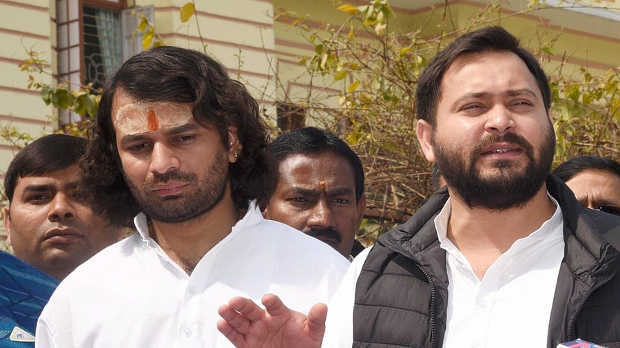 Rashtriya Janata Dal (RJD) leader Tejashwi Yadav along with Tej Pratap speaks to media representatives during the Budget Session of Bihar Assembly. Credit: PTI Photo