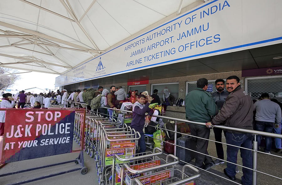 Passengers are seen at the ticket counters outside the airport after flights were cancelled following temporarily suspension of flights, in Jammu. Credit: Reuters file photo.