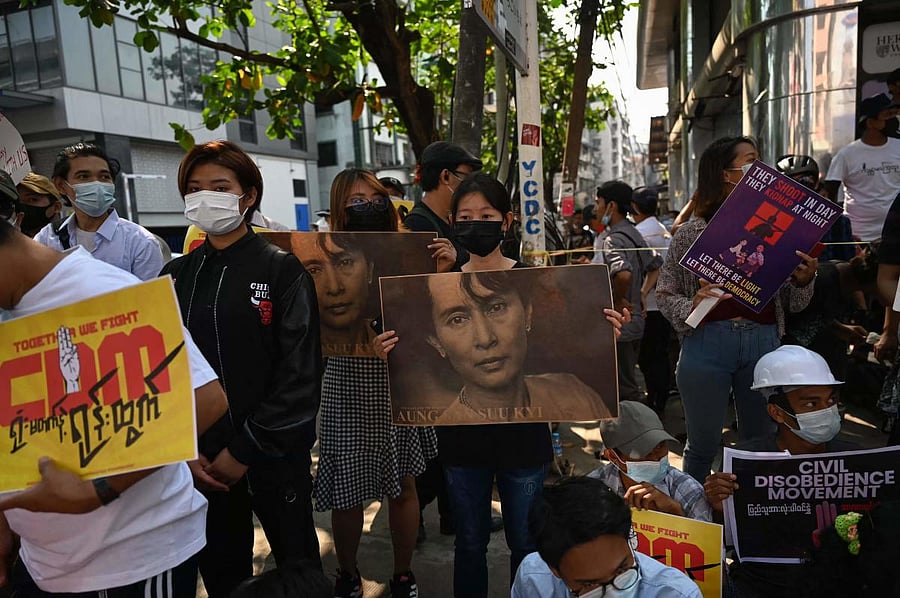 Protesters hold images of detained Myanmar civilian leader Aung San Suu Kyi during a demonstration against the military coup in Yangon. Credit: AFP photo.
