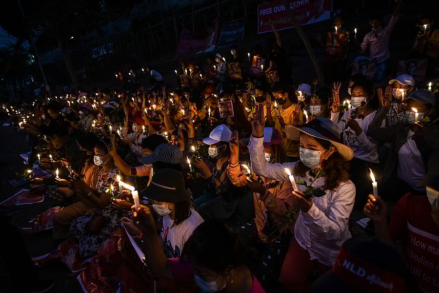 Protesters hold a candlelight vigil outside the US Embassy during a demonstration against the military coup in Yangon on February 21, 2021. Credit: AFP Photo