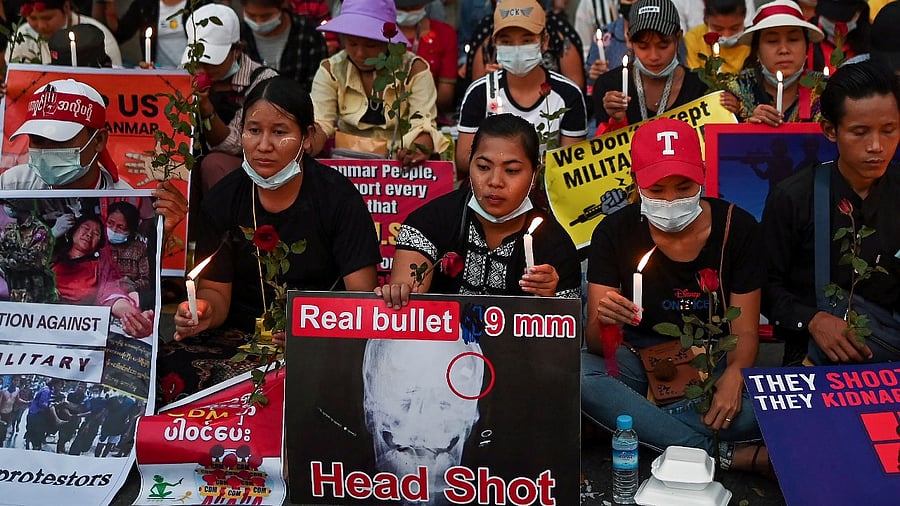People gather during a candlelight vigil to protest against the military coup in Yangon, Myanmar, February 21, 2021. Credit: Reuters Photo