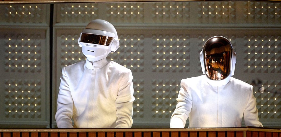  French musicians Thomas Bangalter (L) and Guy-Manuel de Homem-Christo of Daft Punk perform onstage during the 56th GRAMMY Awards. Credit: AFP Photo