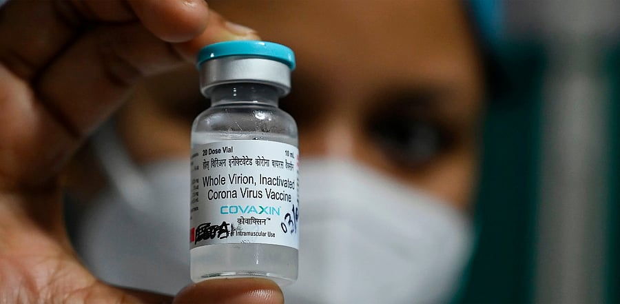A health staff shows a vial of 'India's first indigenous Covid-19 vaccine, "Covaxin" at the Kolkata Medical College and Hospital in Kolkata. Credit: AFP Photo