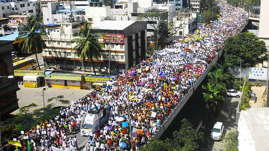 Members of the Karnataka Private School Managements, Teaching and Non-Teaching Staff Coordination Committee (KPMTCC) take part in a protest rally against the state government's order for private schools to charge only 70% of the tuition fees in this academic year, in Bengaluru. Credit: PTI Photo