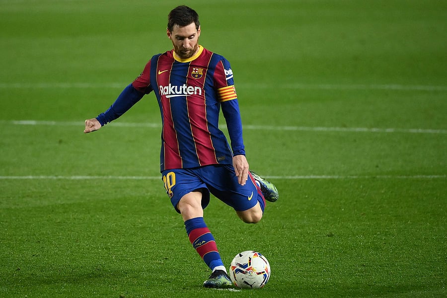 Lionel Messi kicks the ball during the Spanish league football match between FC Barcelona and Elche CF. Credit: AFP Photo