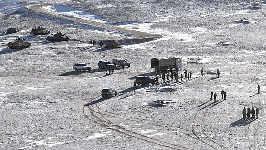 This file undated handout photograph released by the Indian Army on February 16, 2021 shows People Liberation Army (PLA) soldiers and tanks during military disengagement along the Line of Actual Control (LAC) at the India-China border in Ladakh.  Credit: AFP File Photo