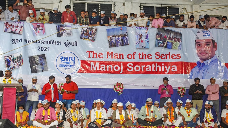 Aam Aadmi Party (AAP) candidates at an event after emerging victorious in multiple seats in the Surat Municipal, during counting day of Gujarat Municipal Corporation polls, in Surat. Credit: PTI.