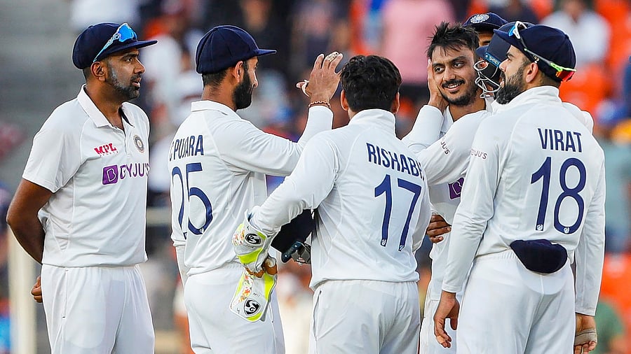 Indian team celebrates the dismissal of England's Joe Root on the second day of the 3rd Test between India and England, at Narendra Modi Stadium in Ahmedabad. Credit: Twitter Photo/@BCCI/via PTI