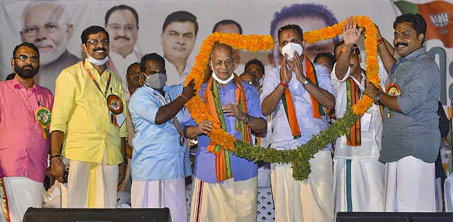 'Metro Man' E Sreedharan being garlanded as he formally joins Bharatiya Janata Party (BJP), in Malappuram, Thursday, Feb. 25, 2021. Credit: PTI Photo