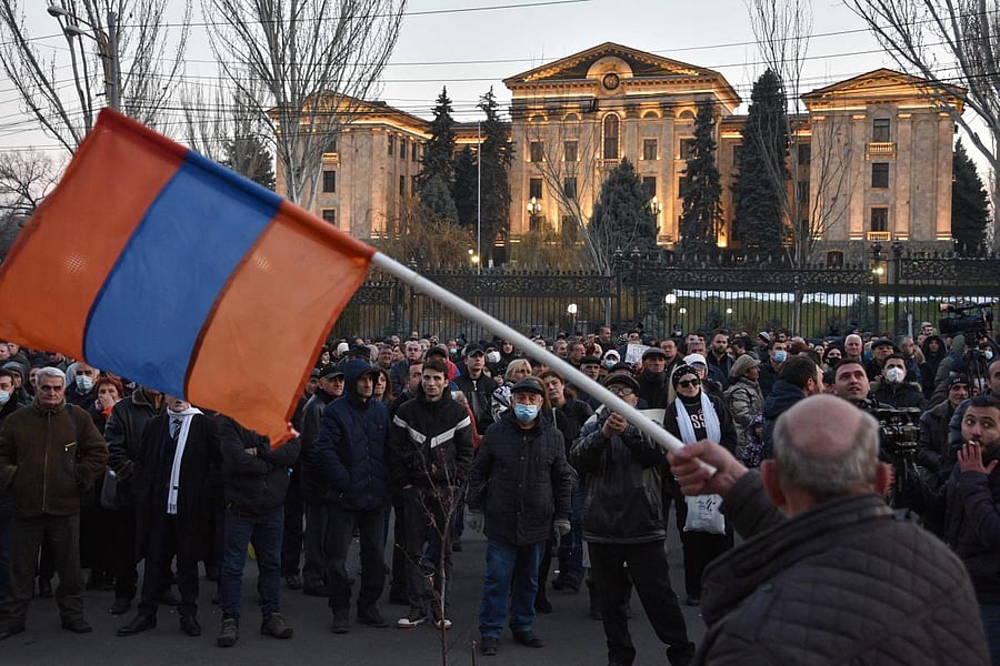 Opposition supporters rally outside the National Assembly building to demand Prime Minister Nikol Pashinyan's resignation over his handling of last year's war with Azerbaijan, in Yerevan on February 26, 2021. Credit: AFP Photo