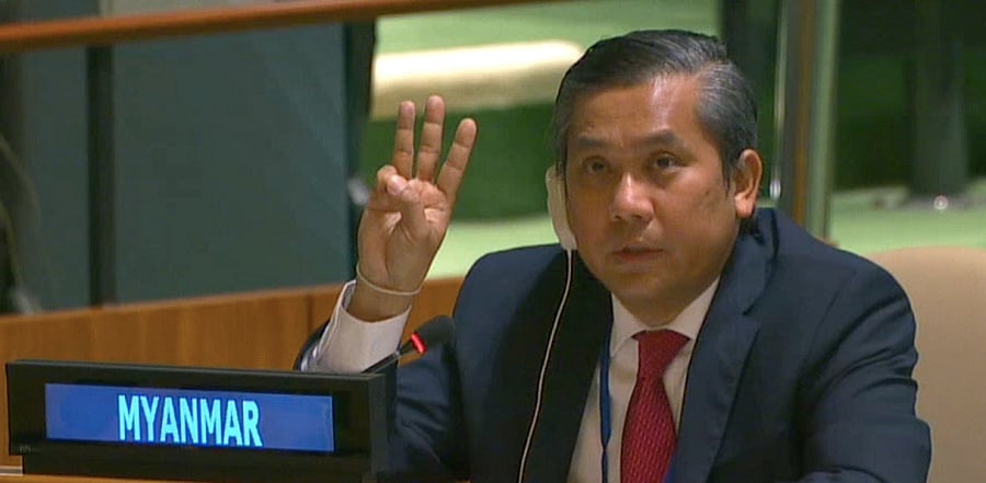 Kyaw Moe Tun holds up three fingers at the end of his speech to the General Assembly. Credit: Reuters Photo