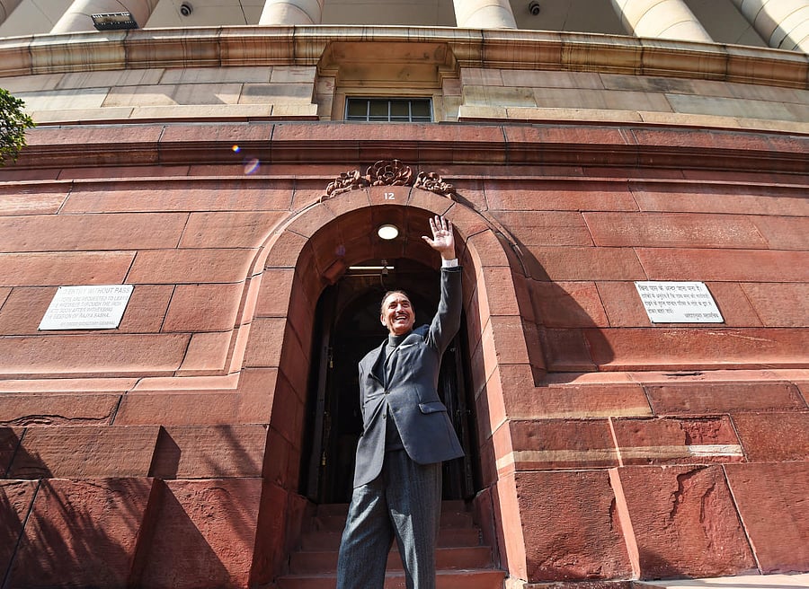 Senior Congress leader Ghulam Nabi Azad, who is retiring from the Rajya Sabha next week, waves at media during the ongoing Budget Session of Parliament, in New Delhi, Tuesday, Feb. 9, 2021. Credit: PTI File Photo