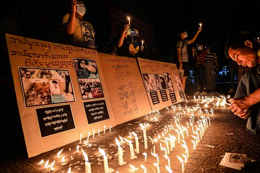 Protesters take part in a ceremony to pray for those who died during demonstrations against the military coup in Yangon. Credit: AFP Photo
