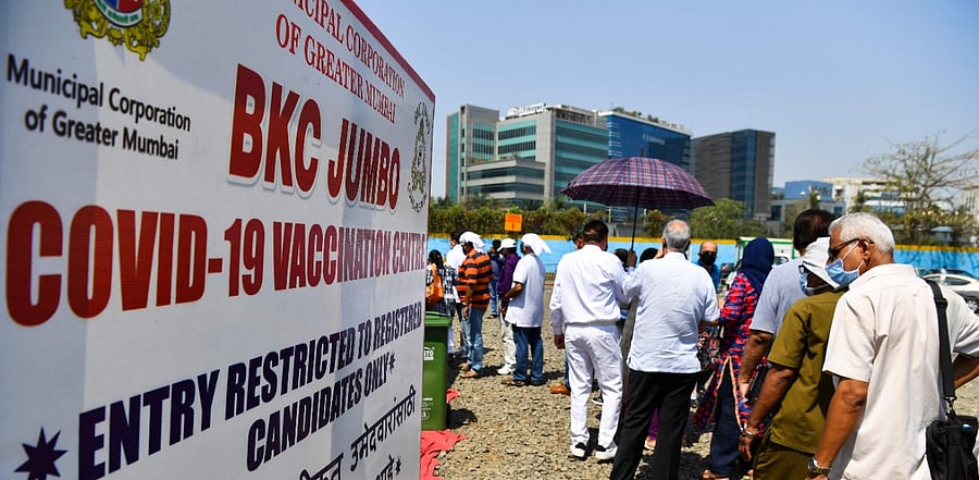 Senior citizens wait in a queue outside a vaccination centre in Mumbai. Credit: AFP Photo