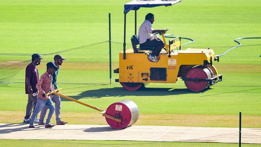 Ground staff busy providing final touches to the pitch at the Narendra Modi Stadium in Ahmedabad on Wednesday, ahead of the fourth Test. Credit: PTI Photo
