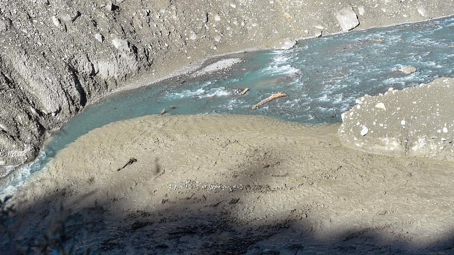 Search and rescue operation near the Raini village halted due to surge in water levels of Rishiganga river, in the aftermath of Sunday's glacier burst in Joshimath causing a massive flood in the Dhauli Ganga river, in Chamoli district of Uttarakhand. Credit: PTI.