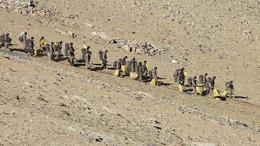 This file undated handout photograph released by the Indian Army on February 16, 2021 shows People Liberation Army (PLA) soldiers during military disengagement along the Line of Actual Control (LAC) at the India-China border in Ladakh. Credit: AFP