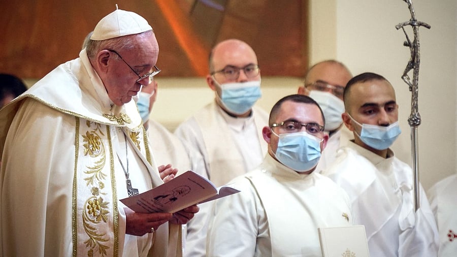Pope Francis leads mass at Baghdad's Saint Joseph Cathedral on the second day of the first papal visit to Iraq on March 6, 2021. Credit: AFP Photo