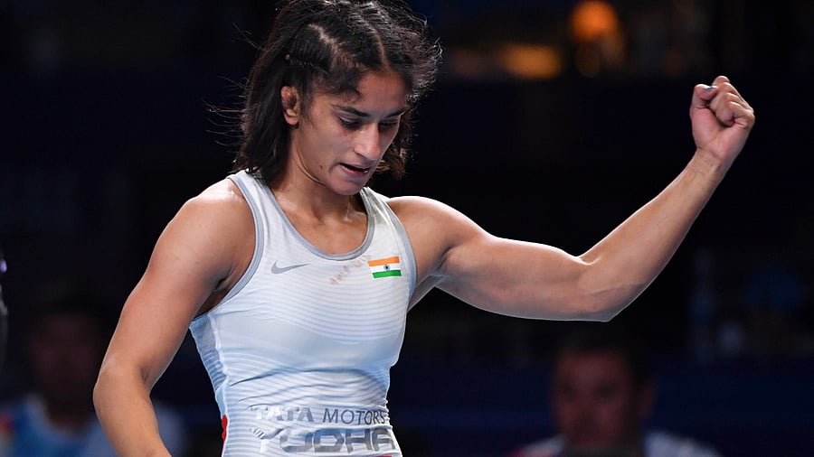 Vinesh Phogat of India reacts as she won the gold medal. Credit: AFP Photo