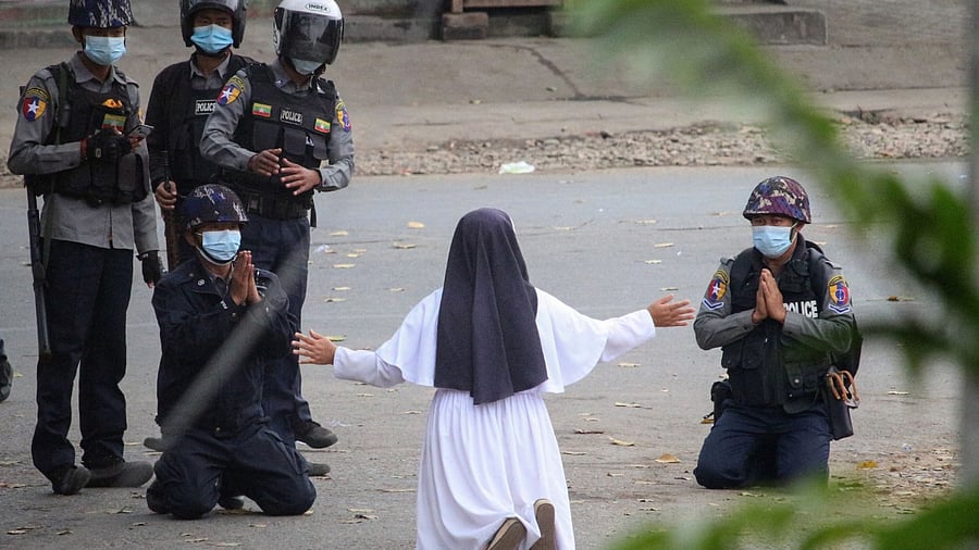 Nun pleading with police not to harm protesters in Myitkyina, Myanmar. Credit: Myitkyina News Journal/AFP