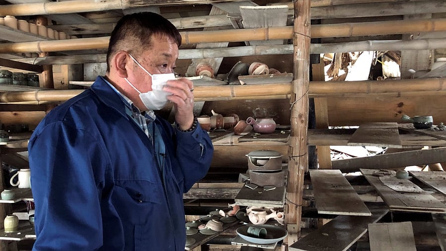 Toshiharu Onoda, 59, of the 13th generation to take on the family pottery business, looks at his studio damaged by the March 11, 2011 earthquake and tsunami, in Namie town, near the tsunami-crippled Fukushima Daiichi nuclear power plant in Japan. Credit: Reuters Photo