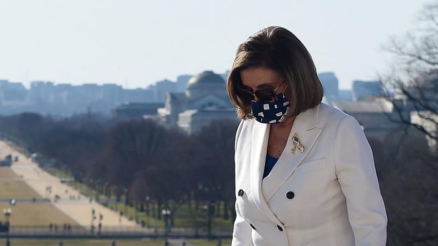 Speaker of the House Nancy Pelosi (D-CA) departs the Bill Enrollment for the American Rescue Plan Act ceremony after the House Chamber voted on the final revised legislation of the $1.9 trillion Covid-19 relief plan, at the US Capitol. Credit: AFP.