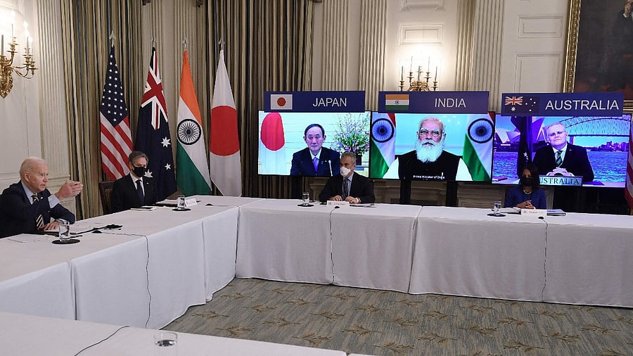 US President Joe Biden (L), with Secretary of State Antony Blinken (2nd L), meets virtually with members of the "Quad" alliance of Australia, India, Japan and the US, in the State Dining Room of the White House in Washington. Credit: AFP Photo