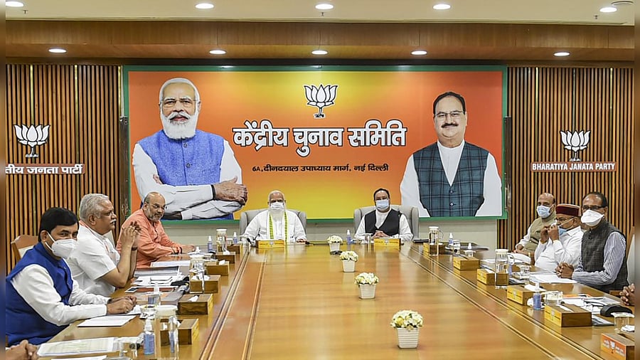 Prime Minister Narendra Modi chairs BJP's Central Election Committee (CEC) meeting, in New Delhi, Saturday, March 13, 2021. Union Home Minister Amit Shah and BJP National President JP Nadda are also seen. Credit: PTI Photo