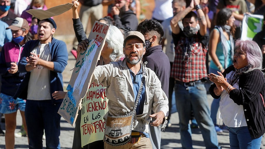 Demonstrators protest during the visit of Argentina's President Alberto Fernandez to Lago Puelo to monitor the lands that were ravaged by fires, in the province of Chubut, Argentina. credit: Reuters Photo