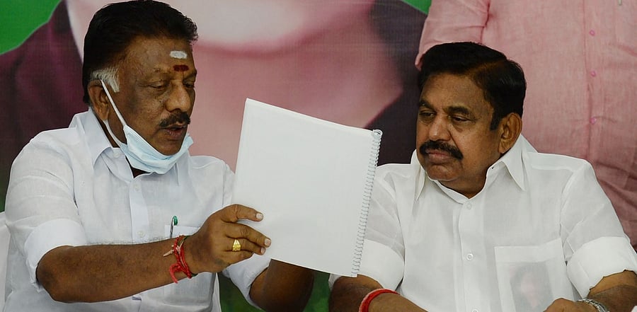 Edappadi.K. Palanisamy (R) talks to O. Pannerselvam during the release of the party election manifesto. Credit: AFP Photo
