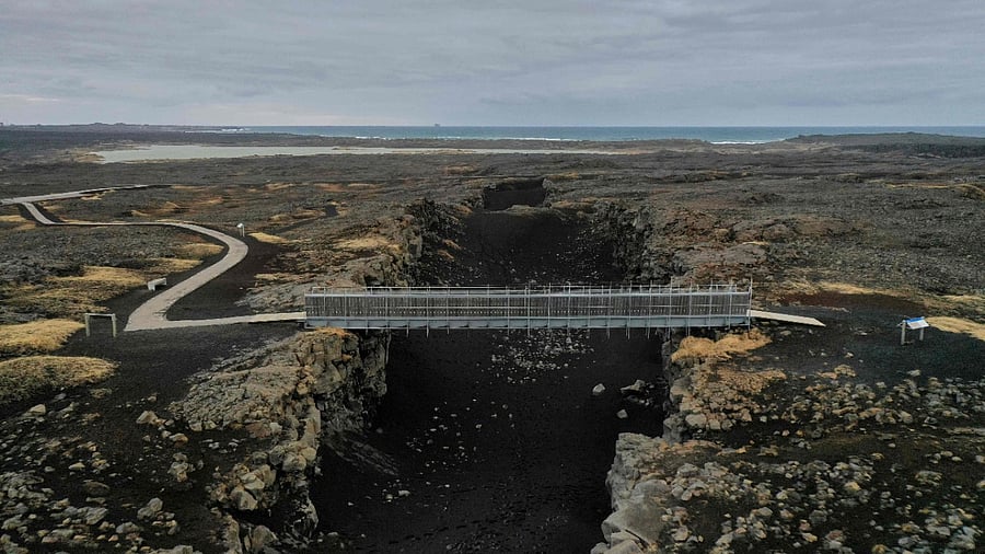 "Bridge between Continents", a footbridge linking the Eurasian and North American tectonic plates, near the town of Grindavik on the Reykjanes peninsula, Iceland. Credit: AFP File Photo
