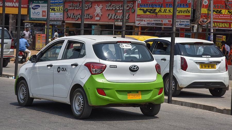 An Ola cab is seen on the road. Credit: DH Photo