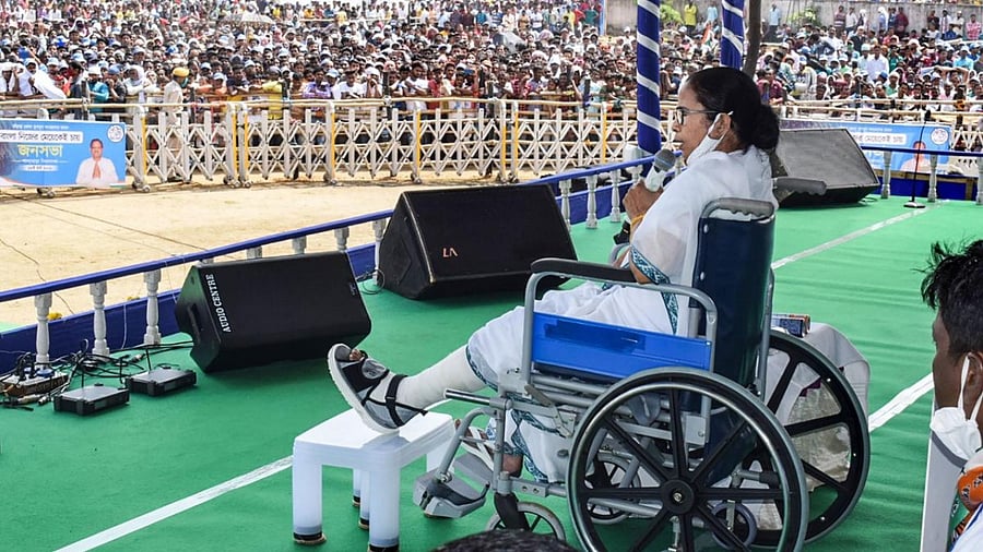 West Bengal CM Mamata Banerjee, in a wheelchair, addresses an election rally in Bankura ahead of the Assembly polls. Credit: PTI Photo