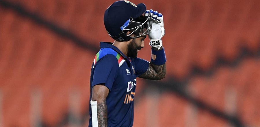 Surya Kumar Yadav walks back to the pavilion after his dismissal during the fourth T20I between India and England. Credit: AFP Photo