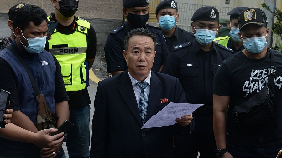 North Korean embassy counsellor Kim Yu Song reads a statement outside the compounds of the North Korean embassy in Kuala Lumpur. Credit: AFP Photo