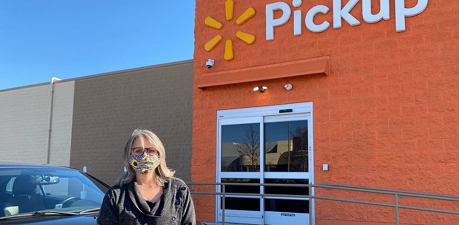 DoorDash driver Kat Ensey outside her local Walmart Pick Up. Credit: Reuters Photo
